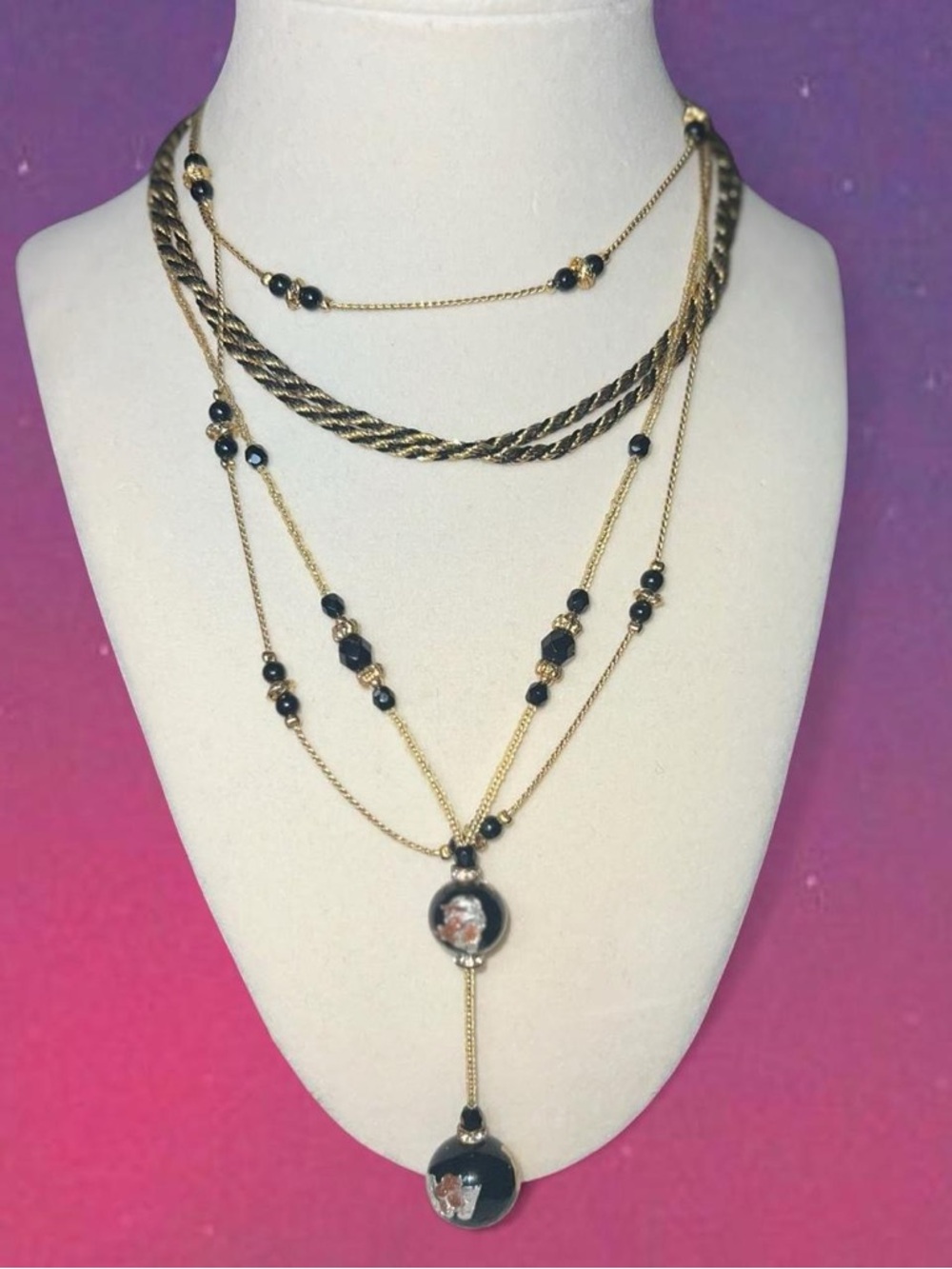 Black and gold layered necklace with beaded details